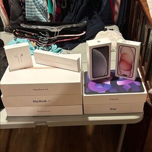 2 Apple iPhone, AirPods, iPad, iPad Air, 1 Pencil, 3MacBook Air 9 Empty Boxes.